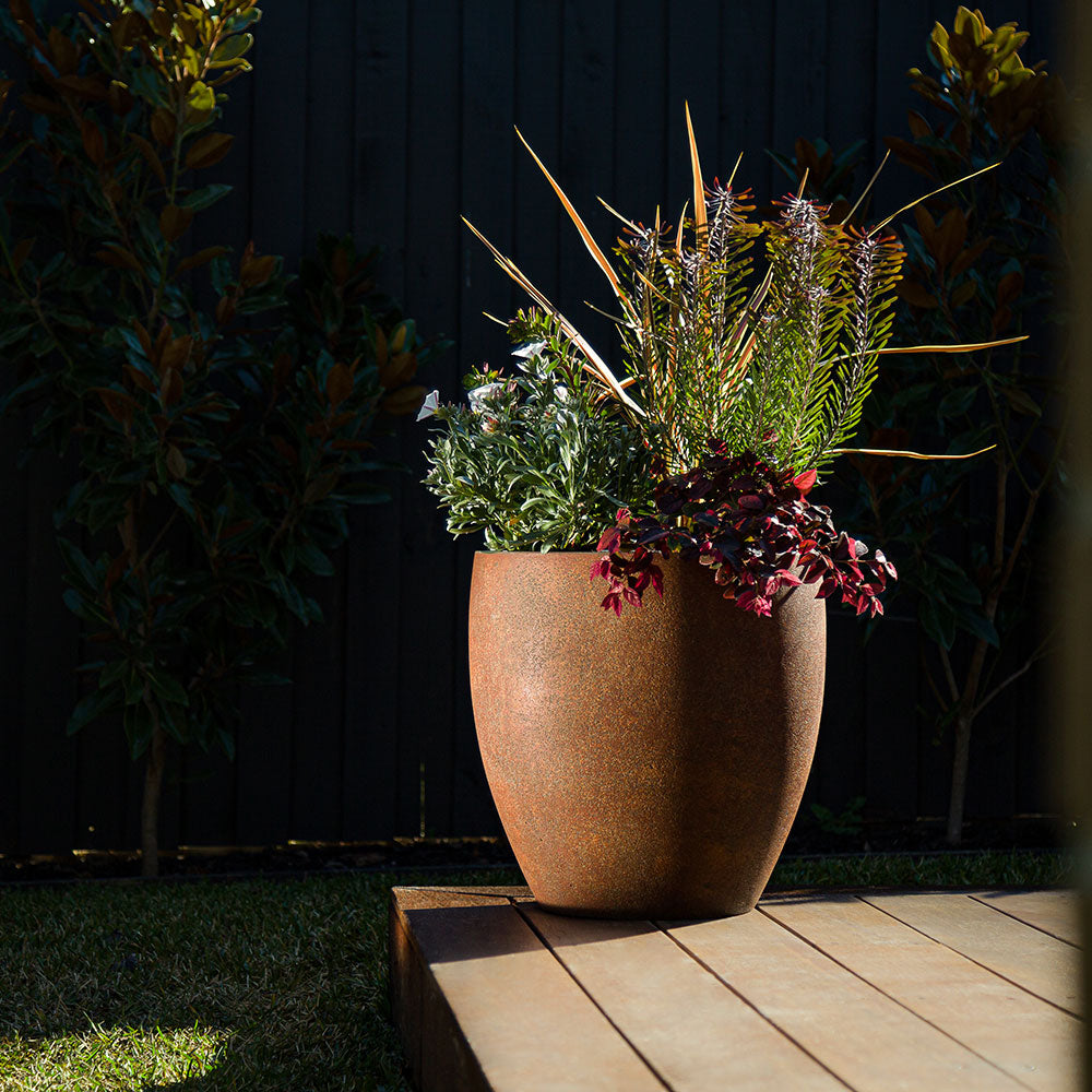 Modstone Montague Egg Pot - Rust - in position - Available at iPave Natural Stone
