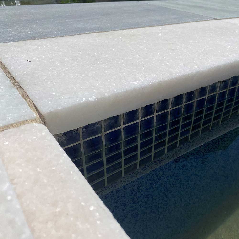 Cristallo Bianco Tumbled Marble 600x400x30/60 Drop Nose Coping - 1st Quality - Laid around pool edge - Available at iPave Natural Stone